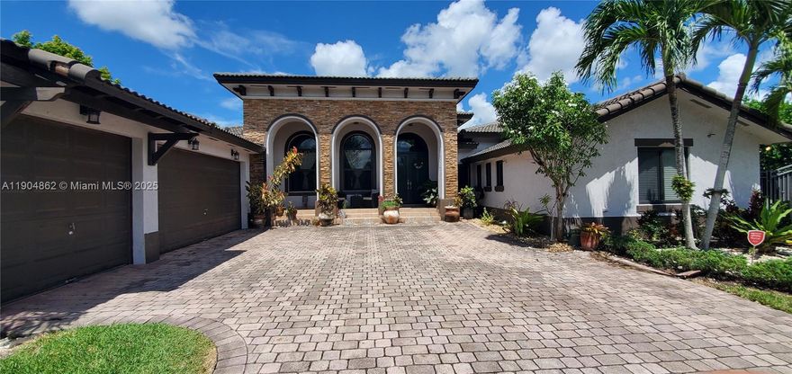 Presented by Estatewide Properties. Elegant Mediterranean Estate on ¼ Acre with 3-Car Garage & Gazebos! Offering 3,390 SF living (4,530 total) near Florida’s Turnpike, this 5 bed, 4 bath home features soaring 18’ ceilings, a split floor plan, huge master suite, large family room, and full 3-car garage. Extended brick-paver driveway provides ample parking plus room for boat/RV. Private backyard with covered patio and two gazebos is perfect for entertaining or relaxing. Highlights include barrel tile roof, grand double-door entry, 8’ sliding glass doors, designer tile, and decorative paver walkways. A must-see in a sought-after community!