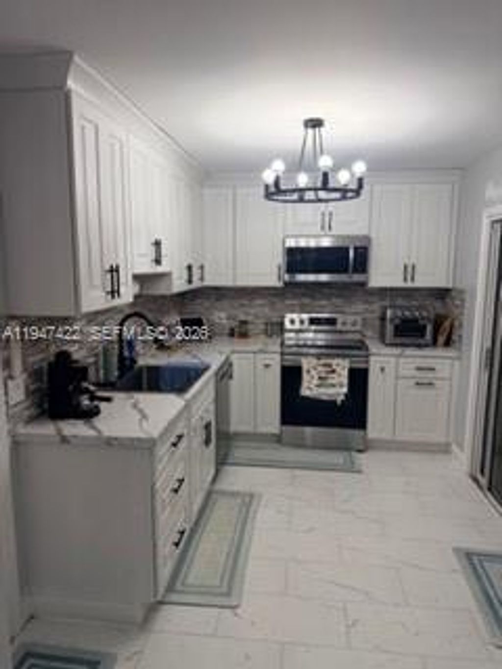 Photo of 1645 SE North Blackwell Dr, Port St Lucie, FL 34952 (MLS # A11947422)