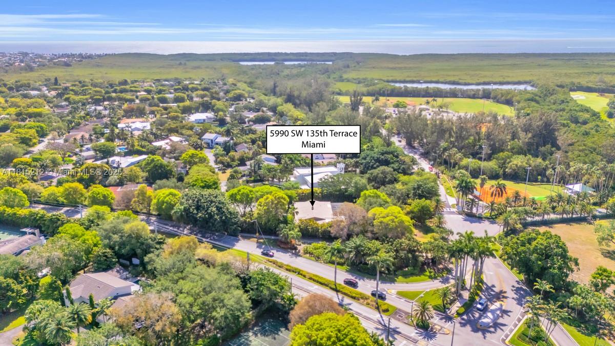 Opportunity knocks in Pinecrest by the Sea! Tucked inside this beloved, guard-gated neighborhood sits one of the largest lots available - 35,284 square feet of land at the end of a cul-de-sac. The existing home, built in 1980, has served one family for over 40 years, but the real value lies in the lot, location, and potential to create something extraordinary. This is your chance to build a custom estate in one of Pinecrest’s most sought-after communities, where neighbors still wave hello and kids ride bikes until dusk. Just minutes from top-rated public and private schools, parks, marinas, and the best of Pinecrest. Whether you envision a modern masterpiece, a timeless classic, or something entirely your own—this rare offering gives you the canvas.