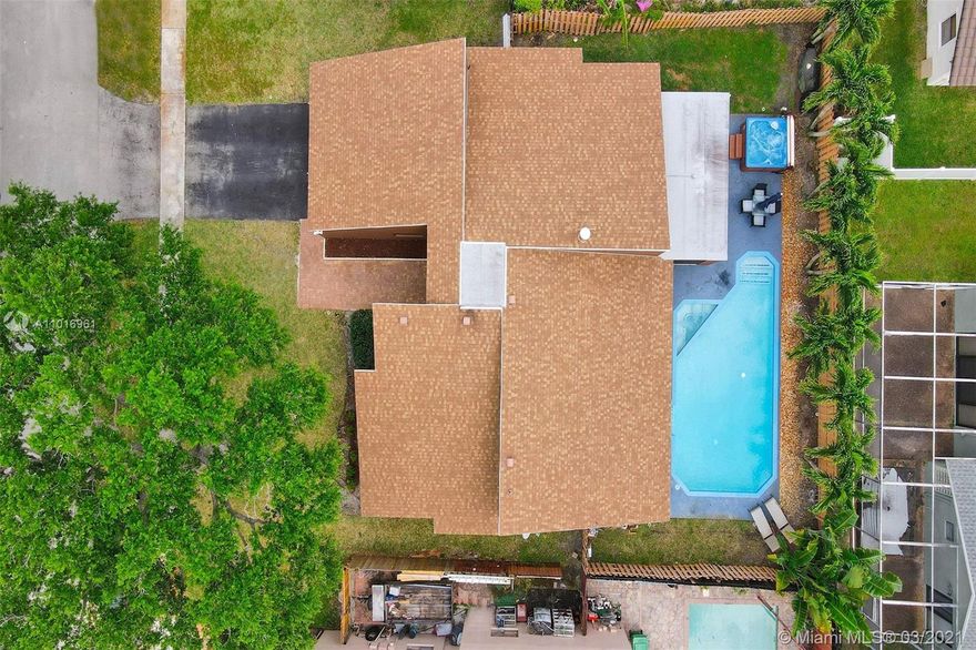 Updated 3/2 pool home!!  Open floor plan with beautiful vaulted wood ceilings in main living area.  Updated kitchen with stainless appliances and quartz counter tops. The roof was replaced in 2018, Air condition was installed in 2018, pool pump in 2020 and water heater in 2018. The seller's have added a screened in patio and added pavers around the pool area with separate jacuzzi. The yard is fenced for extra privacy and great for entertaining. The home has been freshly painted and in mint condition!!  Garage partially converted for 4th bedroom seller willing to convert it back..