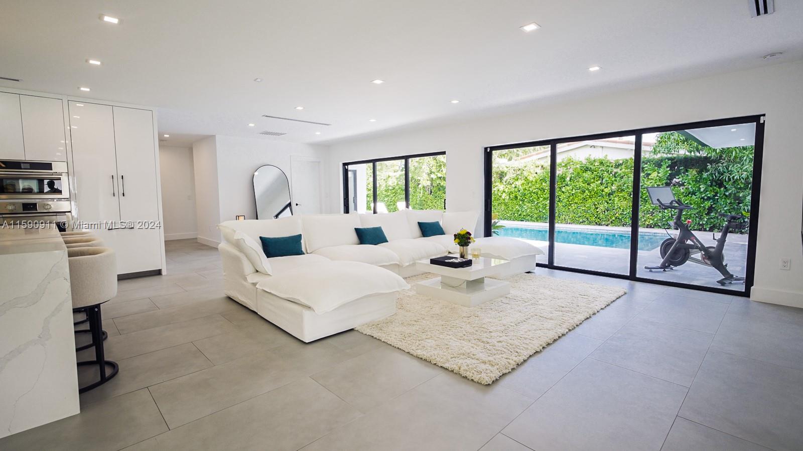 This home was renovated in 2023, creating a sleek, modern living space with top-tier upgrades. Highlights include newly installed impact windows and doors, premium kitchen Fulgor Milano appliances, and custom automated blinds. The outdoor area features a large saltwater pool, complemented by a brand-new roof (2022), all situated on a generous 11,385 SF lot. Additional perks include a 7-car driveway, a 2-car garage, fresh landscaping with an automated sprinkler system, and pre-wiring for outdoor sound and security. Located in a prestigious school district, make this property truly exceptional. This property also boasts an excellent 4-point inspection report, reflecting the great condition of its key systems: the roof, electrical, plumbing, and HVAC