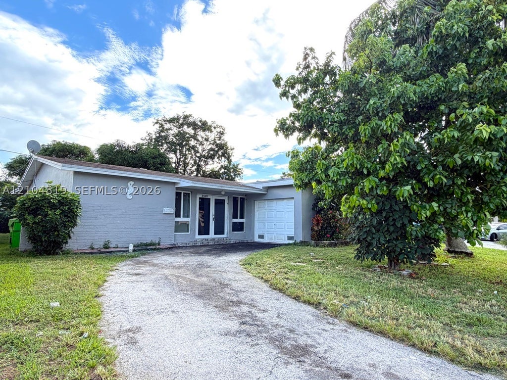 Photo of 8590 NW 25th Ct, Sunrise, FL 33322 (MLS # A12104819)
