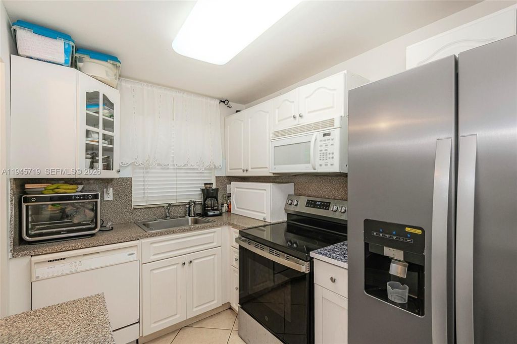 Photo of 9660 Sunrise Lakes Blvd #202, Sunrise, FL 33322 (MLS # A11945719)