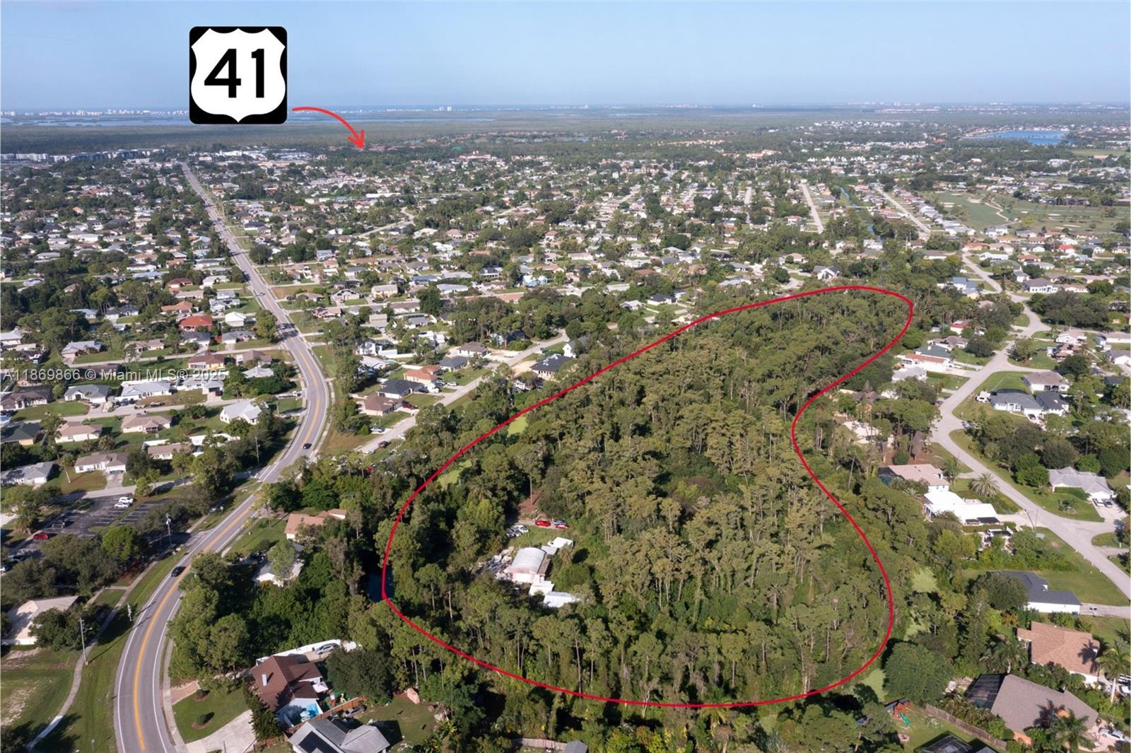 Discover a rare opportunity to own nearly 15 acres of prime land in Fort Myers, perfectly situated within the city yet offering a private, natural retreat. This offering includes three contiguous vacant lots being sold together, providing two access points for convenience and flexibility. The site is rich with Florida’s native flora, including mature trees and the iconic Dahoon Holly, and serves as a sanctuary for local wildlife. A recent survey shows only 0.66 of the property is wetlands and an environmental survey delineates minimal mitigation for full use of the 15 acres. While remnants of previous structures, including an in-ground pool, spa, guest bungalow, carport, and gazebo, remain, the land is a blank canvas for new construction or creative development.