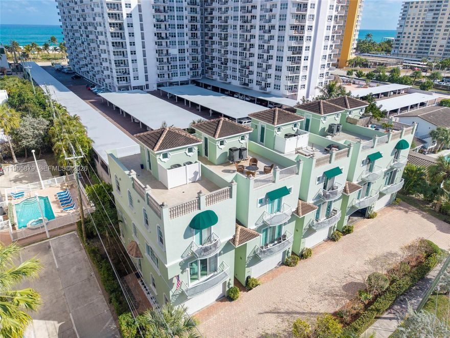 LOCATION! Just a 2-minute walk to the beach and less than 5 minutes on foot to the Pompano Pier and its vibrant dining scene. Ride your private elevator to a spectacular 900+ sq. ft. wraparound rooftop terrace that surrounds the home, offering both Intracoastal and ocean views along with stunning skyline scenery.
Spanning 3,170 total sq. ft., this residence offers the privacy and scale of a single-family home with the convenience of luxury townhome living. The interior features high ceilings, travertine marble floors, Brazilian cherry wood flooring (kitchen), plantation shutters, and hurricane impact glass throughout. The kitchen offers European wood cabinetry, granite countertops, and  stainless-steel appliances, designed for both style and functionality.
The thoughtfully designed floor plan includes a private first-floor suite (1BR/1BA)—ideal for guests, extended family, or a private office. The third floor hosts a junior suite and a spacious primary retreat with dual walk-in closets and a spa-inspired bath.
Located in the heart of the Pompano Beach redevelopment district, just steps from the sand, the pier, and world-class dining, this home offers a rare opportunity to own in one of South Florida’s fastest-growing beachfront communities. Low-maintenance luxury living at its finest. Additional highlights include a 2-car garage/gym, water filtration system, and private backyard.
View the immersive 3D/360° virtual tour for more details. A must-see coastal property!