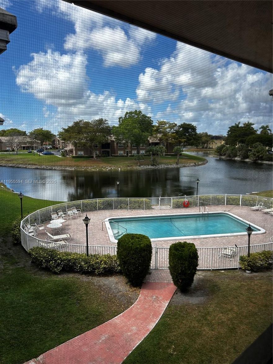 Amazing find in the heart and soul of Coral Springs! Seldom available large 1 bd 1.5 bath corner Lake Forest unit features a bright and spacious living area that flows seamlessly to a private screened-in patio, where you can unwind while taking in serene lake and pool views. This condo offers ultimate convenience with an in-unit washer and dryer, ensuring laundry day is a breeze. The building has already passed its 40-year certification, providing peace of mind for future owners. City Center is walking distance for restaurants and nightlife!  Everything within your fingertips! Just waiting for you to come make it your own!