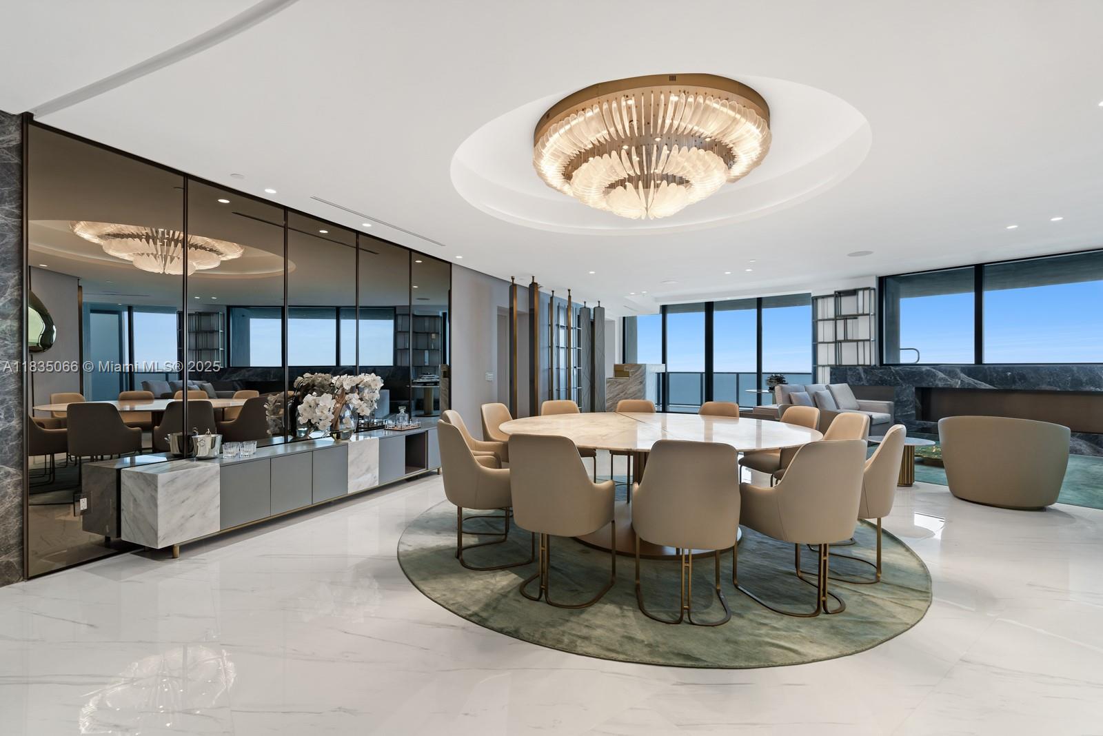 Experience bold luxury in Residence 2701 at the iconic Porsche Design Tower. This meticulously finished 4-bedroom, 5.5-bath sky residence was reimagined from the original floor plan to maximize space and functionality—each bedroom features its own en-suite bathroom and custom closet. Private elevator entry leads to soaring ceilings and floor-to-ceiling glass showcasing panoramic ocean, Intracoastal, and city views. The signature car elevator delivers your vehicle directly to your private garage in the sky. Expansive terraces, a summer kitchen, and private plunge pool offer seamless indoor-outdoor living. Enjoy a sleek open kitchen with Miele appliances and refined finishes, plus access to world-class amenities: restaurant, beach service, spa, car lounge, fitness center, and concierge.