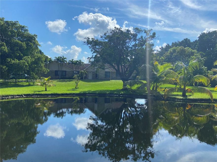 This 5,133 sf10 bedrm 5-2 1/2 bath facility-home w/ pool,fireplace, Guest House.Pond in front.NEEDS TLC!Previously group Home used as facility,located  Sunshine Ranches.Roof 1999. Drainfield work done  2010.Property Use on tax records is for a Hospital/Privately owned & zoned RR(Rural Ranches District)Lot is 1.998 acres 95,823 sf.Living Room-Dining room area is the center of the home.Most bedrooms are on the right.Kitchen On left w/pantry,broom closet.Across from kitchen is an open office area;can be changed to a breakfast knook,overlooking the pool.Laundry room.Addl Bedrms beyond this area on the left.Spot lights in parking lot.Cameras throughout the inside.Hurricane Shutters.No Garage.3 septic tanks,Generator,2 separate electric meters EXCLUDED FIRE ALARMS/ EXTINQUISHERS/ALARM SYSTEM