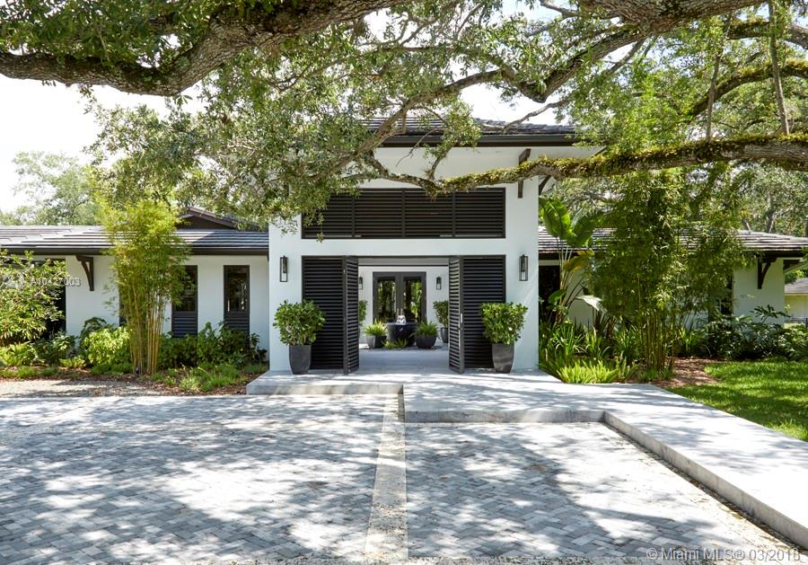 Fully rebuilt in 2015, this exceptional 6,159 SF home is located in the peaceful guard-gated community of Snapper Creek Lakes and has access to the community’s private marina. Exposed courtyard foyer with fountain leads to the spacious family, living and dining areas with sweeping views to the expansive backyard. The large gourmet chef’s kitchen flows into the living areas, all exposed to magnificent garden and pool views. All bedrooms contain spectacular en suite bathrooms with exquisite top-of-the-line finishes. Master bedroom and bathroom feature beautiful views as well as a large walk-in closet with custom built-ins. The backyards spacious outdoor pavilion and summer kitchen lend themselves to entertaining friends and family amongst the lush garden setting and sparkling pool.