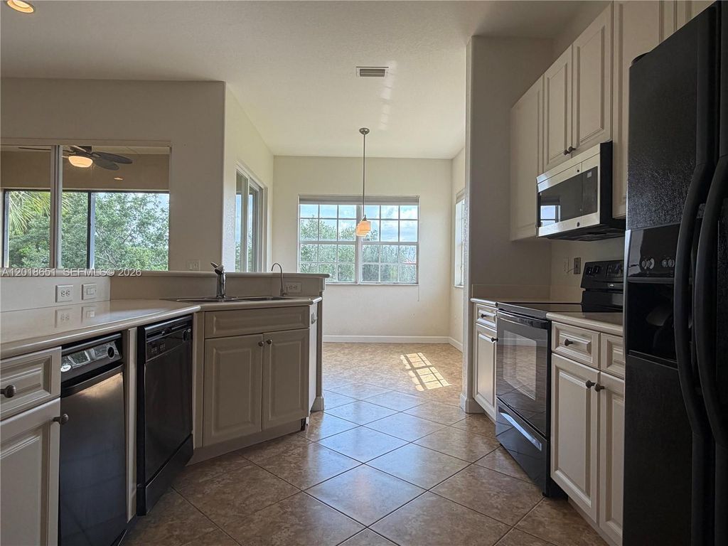 Photo of 8344 NW 127th Ln #26-F, Parkland, FL 33076 (MLS # A12018651)