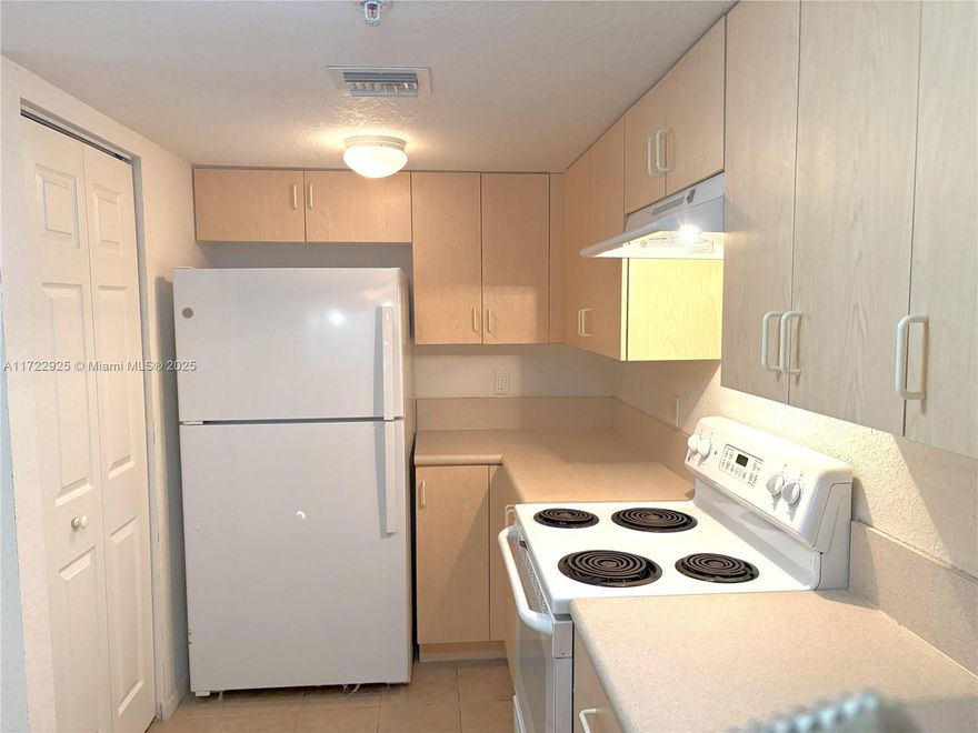 What a Perfect Mother’s Day gift, whether you’re an Empty Nester, dowsing or needing a sinter retreat; this Condo is Drastically Reduced for quick sale! 2,2 with Screened Patio, 1066 sq Ft' BELOW Market Value for quick CLOSE! ...READY TO MOVE IN NOW All Carpet, Padding, etc. removed for new Buyer's choice of New flooring! CLEAN-BRIGHT READY TO Show NOW! Custom lighting, master bath shower stall, white appliances, washer/dryer in unit, pantry in kitchen, ceiling fans. Impact glass sliding glass to screened back patio with storage closet. Newer A/C, HWH. Centrally located, 55+ community, pet friendly, manned guard gate, clubhouse, 2 pools, Golf course free to Community, Pickle ball, Tennis, close to turnpike, I-95, Int’l Airport , shopping, beaches, restaurants. Can be Rented immediately.