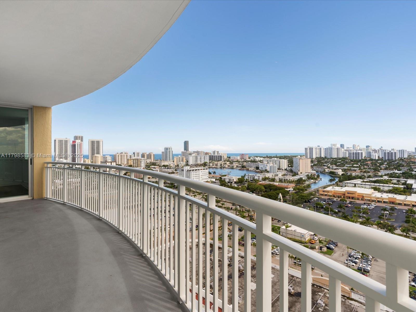 Welcome to the DOU Condominium, where this stunning 2-bedroom, 2-bathroom corner unit awaits. Spanning 1,354 sq. ft., this residence offers a spacious open layout, enhanced by central air and heating. The wraparound balcony provides sweeping views, perfect for relaxation. The modern kitchen seamlessly connects to the living and dining areas, ensuring a comfortable and stylish environment. Both bedrooms feature ample storage, with the primary suite offering an ensuite bath. Enjoy amenities such as a pool, spa/hot tub, sauna, and secure entry with high-impact doors. Additional features include a garage, assigned parking, elevator access, and a vibrant community atmosphere. This unit is freshly painted with new vinyl flooring, ready for you to call home.