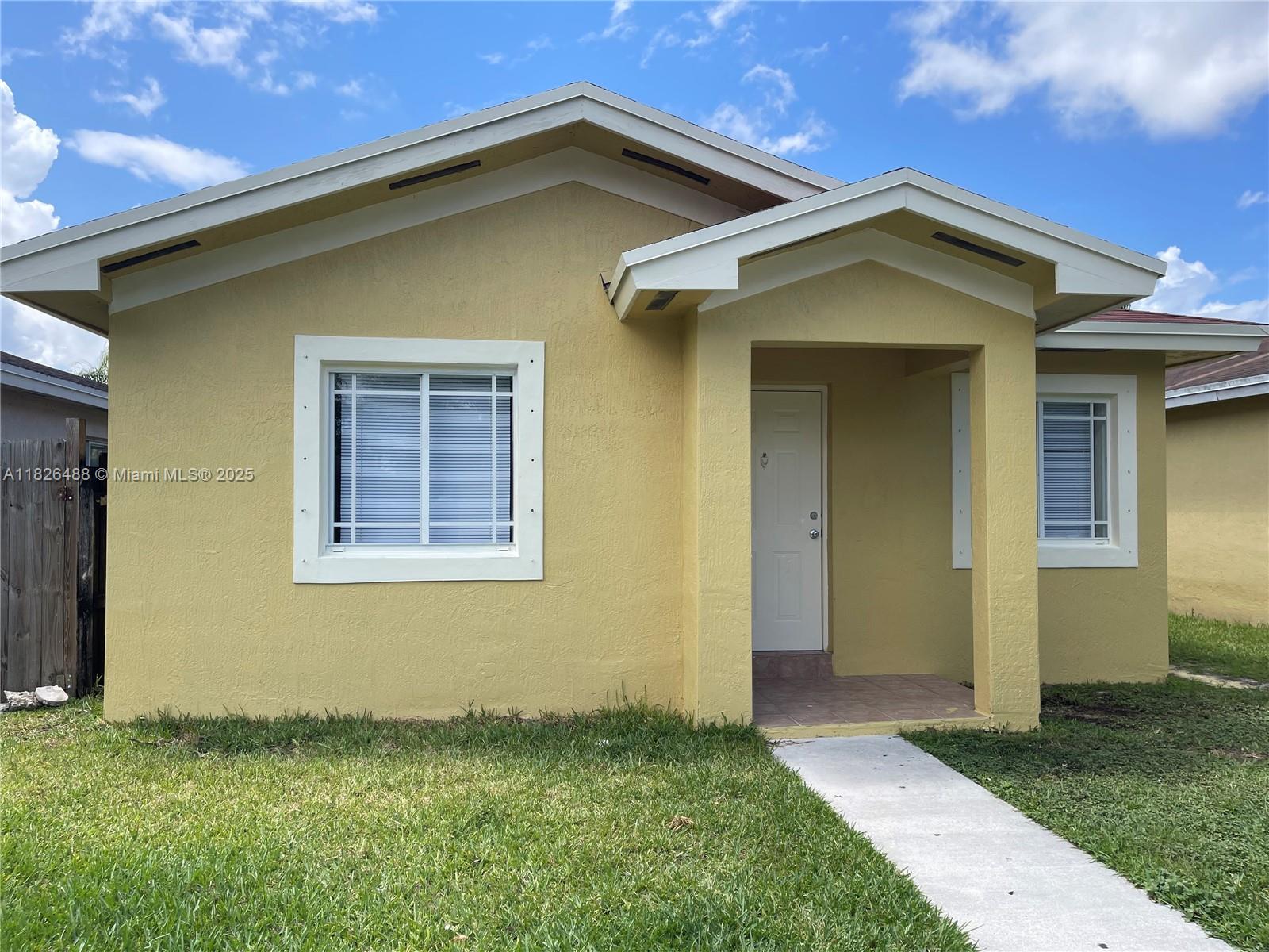 Certainly, worth considering home! Allow me to present this appealing 3-bedroom, 2-bath single-family home with back patio nestled in the Villages of Palm Bay community in Florida City. Situated in a gated community with walking trail, this home offers peace of mind with security gate access. Residents enjoy the community's swimming pool and playground. The home features renovated bathroom for added comfort. Fresh window blinds enhance privacy and aesthetics. Don't miss out on this opportunity to make this house your home! Don't delay request your appointment today, it's the lowest rental price in the community.