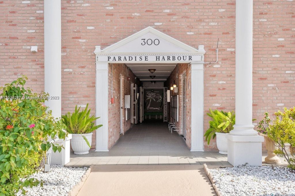 Photo of 300 Golden Isles Dr #114, Hallandale Beach, FL 33009 (MLS # A11330247)