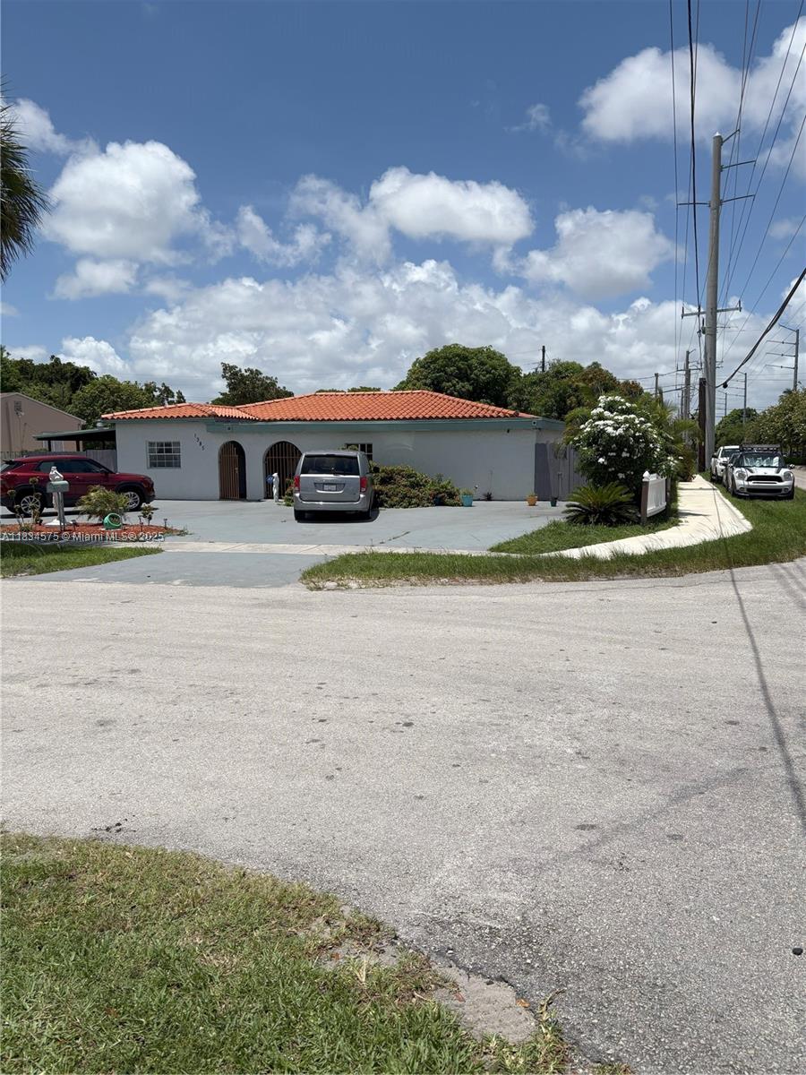 Location, Location, Locations, less than 4 miles to the Ocean and Bal Harbor Shops!!! Cozy and Spacious Home with almost .25 Acre (10,622 sq. feet). Corner and Fenced Lot with Mango, Avocado and other trees, with huge driveway in the front and a huge patio roof in the backyard located in North Miami Beach. So much space to build your pool, gazebo, mini golf and more for your family to live or to flip. 6 Miles to Aventura Mall. A promising are with Costco just 2 miles away, close to Biscayne area with has plenty of options to shop and services. Big and well distributed floor plan with plenty of living space. The kitchen is about 5 years old with good. AC unit fairly new with UV Sanitation system. Nice tile roof with 6 + years. Do not miss this great investment opportunity.