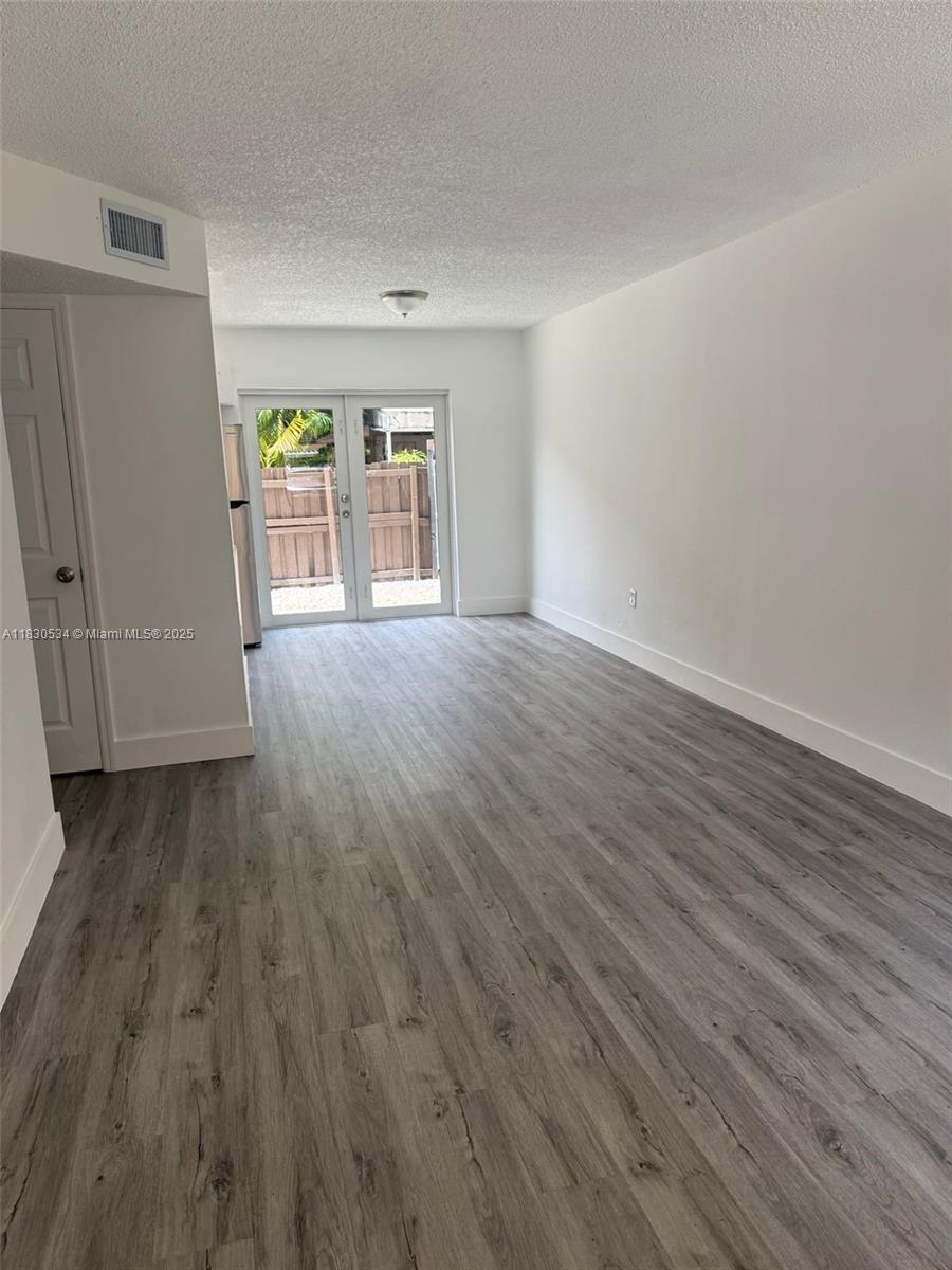Beautiful, Completely remodeled 3/1.5 bath unit located on the first floor with a fenced patio area. Unit features 2 parking spaces and washer/dryer inside. New floors, new kitchen, new bathrooms. Walking distance to supermarkets, schools, etc.