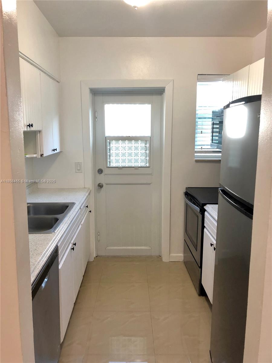 Beautifully water front property updated 1/1 apartment on 1st floor Freshly painted ALL WHITE, tile floor throughout. Stainless Steal Kitchen Appliances, dishwasher & Quartz counter tops. Washer and Dryer IN THE UNIT, central A/C, Impact windows/doors, street parking. Apartment is available immediately fast approval. Owner requires 1 first month and 2 deposit. Video Tour Available upon request