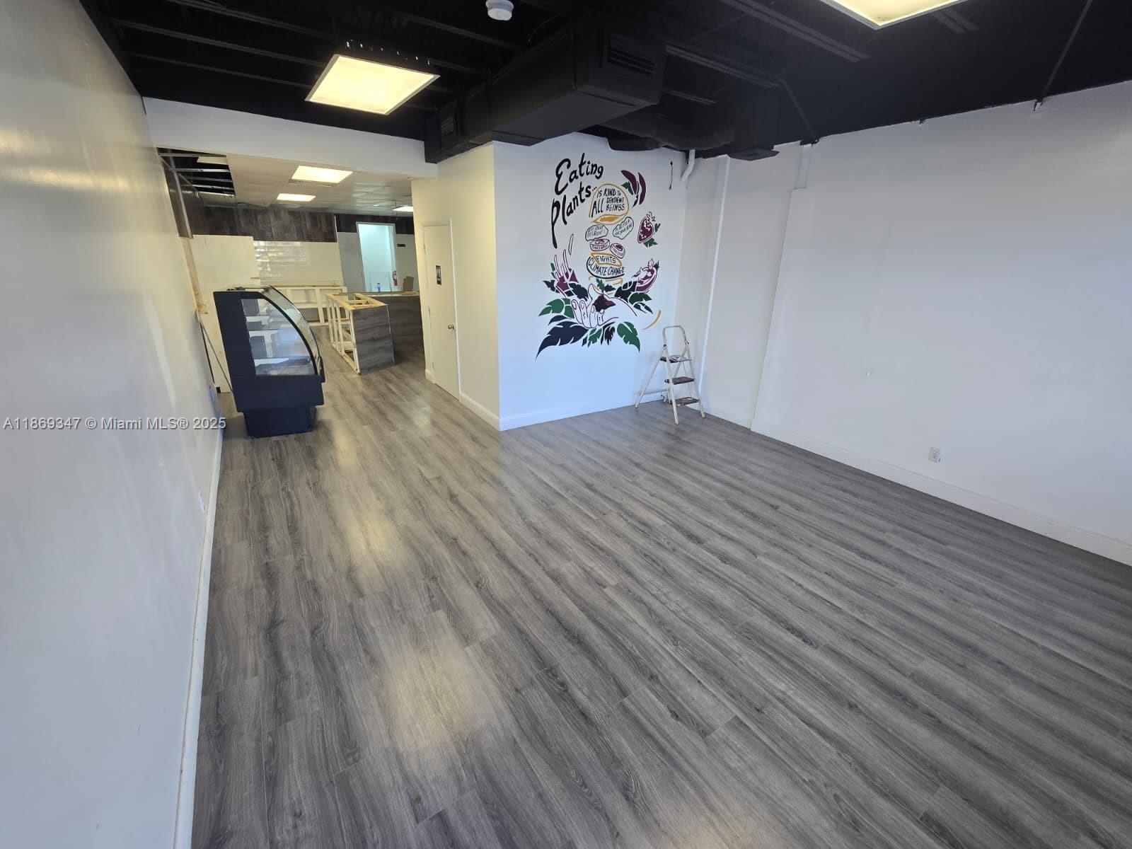 FOR LEASE in Margate! This 1000 +/- SQFT unit is located on the 1st floor of Marquis Square, a 2-story shopping plaza, w/ frontage to State Road 7. The unit was previously set-up as a smoothie shop. Layout includes open area in the front, customer service/line area, 1 restroom, 1 small staff room/office, & a storage/tech room. Tenant responsible for proportionate share of electric. Located in TOC-C zoning, plaza has a diverse set of businesses as long-term tenants, including café, smoke shop, convenience store, beauty salon, pet groomer, & more. Businesses in the area include national chains like Subway, Taco Bell, and Bealls. Plaza is located just down the road from HCA Florida Northwest Hospital, and receives plenty of traffic with annual average daily traffic (AADT) is 53,500 vehicles.