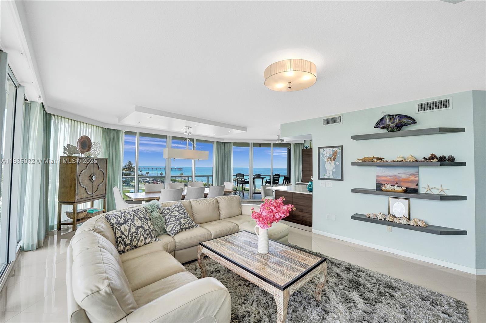 This beautifully updated, sprawling, 3bed 2.5bath, beachfront condo can now be yours! The elevator brings you directly into your private foyer, highlighted by beautiful porcelain floors balanced against the backdrop of turquoise ocean waters. Modern casual touches throughout match any occasion from relaxing with the family or hosting a party. Highlights include a wraparound balcony, a chefs' kitchen with an induction cooktop, French door wall oven, rich natural wood cabinets, quartz counters, extra beverage coolers, updated bathrooms, and an expanded primary closet with built-ins. Located in a luxury 2 tower beachfront compound with tennis courts, East and a West pool, hot tub, gyms, pool side Cafe, club room, valets, front desk staff, and a dog park.