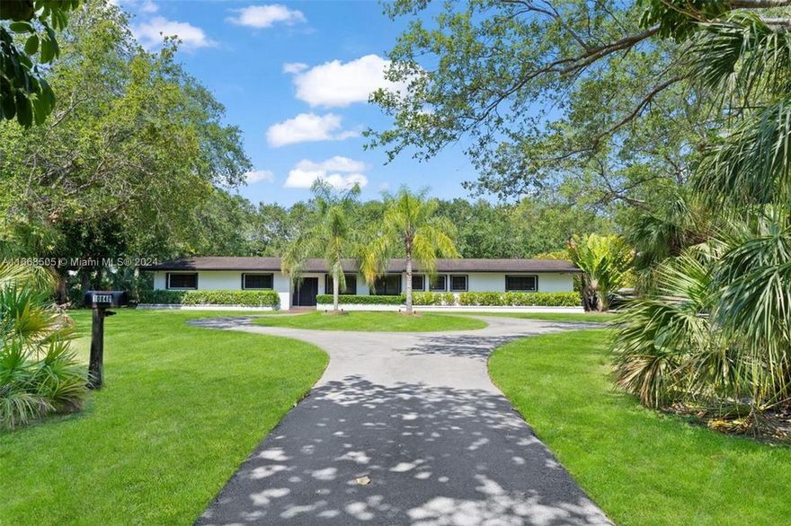 Live, renovate, or build your dream estate on this prestigious 1+ acre lot in Pinecrest. Spanning 48,351 sq. ft., the property offers endless potential for custom home construction or updating the classic existing residence. Inside, a gourmet kitchen with a cozy breakfast nook flows into a flexible space for a family room or home office. Outside, enjoy a private retreat with a covered terrace, large pool, and spacious yard with lush landscaping all the way around with great mature trees. Features include impact-resistant windows, doors, and a large 2-car garage. Home is perfectly livable. Pinecrest's luxurious homes, top schools, and proximity to dining, shopping, and parks make this location unbeatable.