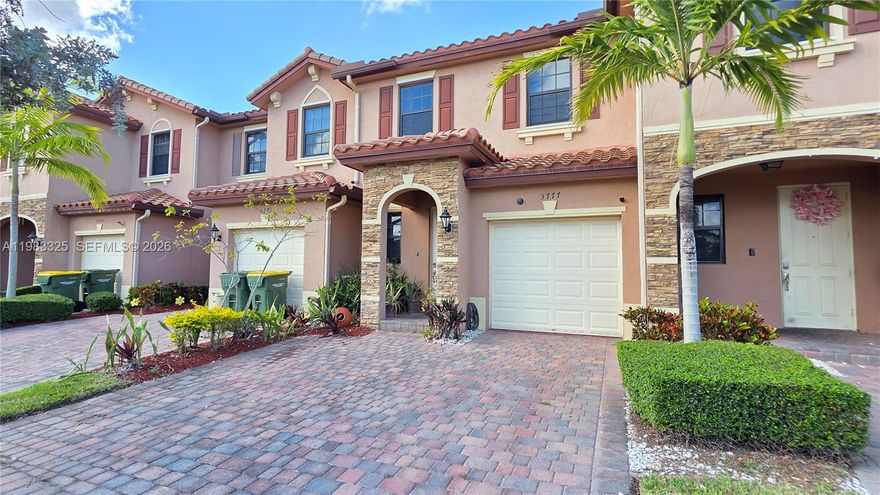 Welcome to Baywinds of Galapagos — one of Homestead's hidden gems. This well-maintained 3-bed, 2.5-bath townhome checks every box: tile floors downstairs, all bedrooms up, stainless steel kitchen appliances, a spacious primary suite with walk-in closet, dual sinks, and walk-in shower. But what really sets this one apart is the outdoor space — step out back to a beautifully decked patio covered by a pergola, complete with serene water features and live fish. It's the kind of spot you'll actually use. Parking is a non-issue here — 1-car garage, 2 dedicated spaces right out front, plus guest parking nearby. Located in a gated community with resort-style pool and playground. Easy access to Homestead Bayfront Park, the Speedway, and major highways. This one's move-in ready — come see it before it's gone.