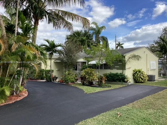 Fantastic opportunity in the heart of Hollywood! As you drive through this quiet, beautiful neighborhood in highly desired Orangebrook Estates, you'll be welcomed by large royal palm trees lining both sides of the street. The house is a meticulously maintained, cozy 3/2 with separate entrance to third bedroom that can be turned into huge master suite or used as separate in-laws quarters. The brand new driveway that parks 5+ cars, along with the large living and Florida rooms make it ideal for entertaining.  Both front and back yards are an oasis of tropical plants and mature trees.  Room to add a pool or put your touch on the landscape. Newer A/C; brand new W/H; all windows impact or have coverings.  Close to hospital, shopping, restaurants, main roads, parks, etc. Must see today!