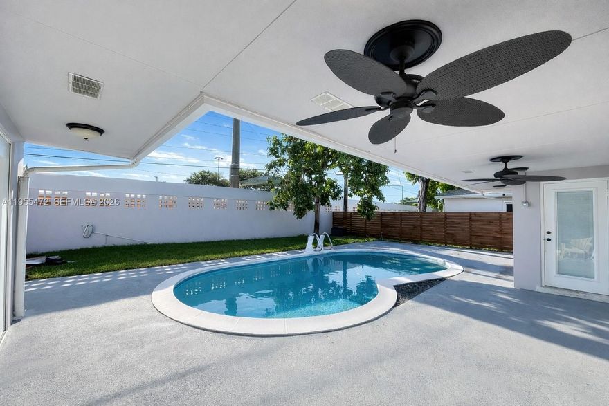 Beautifully remodeled pool home offering 3 bedrooms and 1 full spacioua bathroom, thoughtfully designed with style and functionality in mind. Family room features a private entrance  making it ideal as a game room, home office, or guest suite.
Enjoy a bright open-concept layout with ceramic flooring throughout, complemented by impact windows and doors for peace of mind. The home seeatures a newer roof and a modern white kitchen with quartz countertops and stainless-steel appliances, perfect for both everyday living and entertaining.
A spacious laundry room includes a washer, dryer, and utility sink, along with ample closet space throughout the home for optimal storage.
Step outside to a private backyard oasis, ideal for family gatherings and outdoor entertaining, complete with a covered seating area, sparkling pool with colorful lights, and beautifully maintained landscaping — pool and landscaping included. Tropical Oasis perfect for all year around summer. **SHORT TERM  RENTAL AVAILABLE
