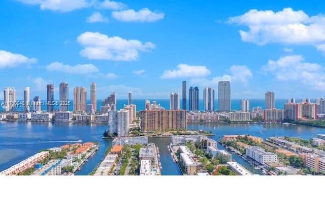Discover waterfront living in this beautifully remodeled first-floor condo on a private island, directly on the water. Enjoy stunning bay views and watch boats pass by from your private balcony. This hidden gem features stainless steel appliances, an in-unit washer and dryer, one assigned parking space, and guest parking. A 25-foot private dock is included, perfect for boating enthusiasts. The building offers a sparkling pool, canal-front charm, and a 24/7 guard-gated entrance. Conveniently located near beaches, upscale shopping, Aventura, and more, with a free community bus for easy access. Don't miss this rare opportunity for luxury and serenity!