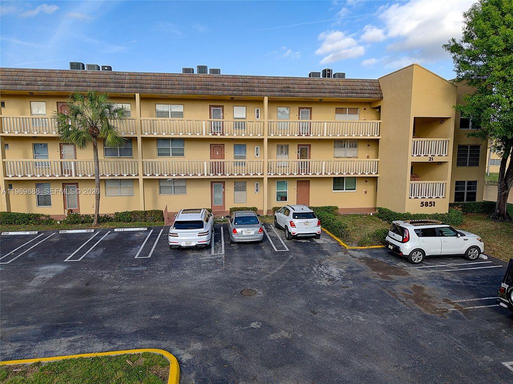 Photo of 5851 NW 62nd Ave #210, Tamarac, FL 33319 (MLS # A11969888)