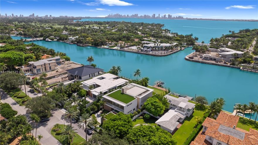Discover unparalleled luxury at 6494 Allison Road, a waterfront masterpiece on gated Allison Island. This newly completed estate boasts 6 bedrooms, 8.5 bathrooms, and 8,024 sqft of refined living space. The primary suite is a private retreat with a sitting area, dual spa-inspired baths, and spacious closets. A MiaCucina kitchen, equipped with premium Wolf and Subzero appliances, is designed for culinary excellence. Control4 automation seamlessly enhances modern living. Additional features include a 2-car garage with lifts, a rooftop terrace, and a gym with sauna and steam rooms. Outdoors, enjoy an infinity-edge pool, summer kitchen, and a 40,000 lb boat lift with two waverunner lifts. A perfect blend of sophistication and craftsmanship.