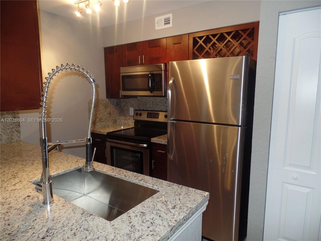 Photo of 2851 N Oakland Forest Dr #111, Oakland Park, FL 33309 (MLS # A12028604)