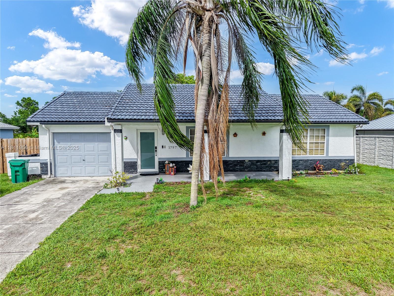 Welcome home to this bright and beautifully maintained 3BR/2BA in the heart of Port St. Lucie. Sitting on a 10,000 sq ft lot, this home features vaulted ceilings, an open layout, and natural light throughout. The split-bedroom plan offers privacy, and the updated kitchen is perfect for gathering. Enjoy peaceful mornings on the screened patio and a backyard full of potential. Solid frame construction, tile roof, and west-facing exposure for stunning sunsets. Centrally located near parks, shopping, and highways. This one just feels like home.