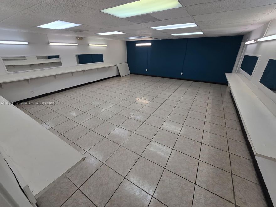 This 2250 +/- SQFT unit is located on the 2nd floor of Marquis Square, a 2-story shopping plaza, with frontage to State Road 7. Unit 216 was part of a beauty school for 20+ years and was remodeled in 2022. Layout: welcoming reception area, 2 open classrooms/work areas (with mirrors and desk-level shelves), 2 private offices, 2 open offices/storage areas, and 1 restroom. Unit can be converted for other approved business use. Can be combined with Unit 215 for a total of 4,250 +/- SQFT space. Tenant responsible for proportionate share of electric. Located in TOC-C zoning, this plaza has a diverse set of businesses as long-term tenants.