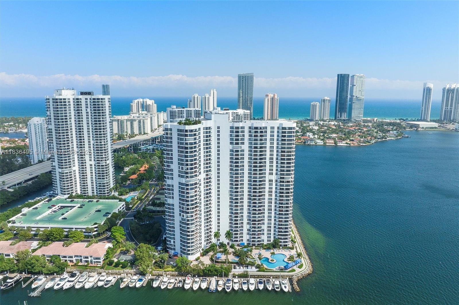 Unit 808 at Mystic Pointe Tower 500 is a 2-bedroom, 2-bath condo in the most sought-after building in the community. This bright and spacious residence offers a split-bedroom layout—each with en-suite bath—floor-to-ceiling windows, and panoramic views of the golf course, marina, and canal. Held by its original owners, the home presents a rare opportunity to renovate and personalize to your unique vision. The unit includes a deeded covered parking space and—as a PLUS—one of the building’s rare storage units. Enjoy resort-style living with access to a waterfront pool, spa, sauna, fitness center, 8 tennis courts, library, valet service, and 24-hour concierge—within a secure, gated environment. Ideally located just minutes from Aventura Mall, beaches, golf courses, and top-rated A+ schools.