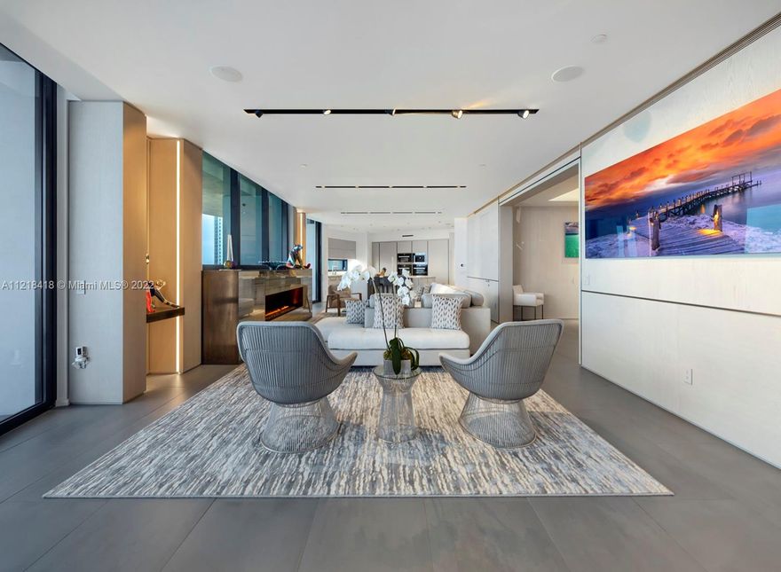 Stunning interior design finishes and brand new furniture make this residence at the exclusive Porsche Design Tower a one of kind gem in the building. Featuring one of the largest floor plans in the building, this apartment is over 4,000 sq. ft. and has 2 car garage on the floor below, allowing for more space in the apartment for a gorgeous formal dining area and media room in the back. This apartment has custom high end finishes and was professionally designed with built in closets, wall panels, custom fireplace and breakfast area, and jacuzzi on the balcony. Furniture is brand new and  negotiable. Enjoy the privacy, security, and novelty of living in one of the most sought after buildings in the world. Exceptional service, private restaurant, salon, concierge, movie theathre and more!