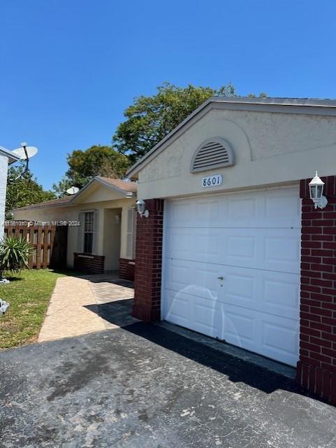 Don't miss out on this adorable Home, it will not last long. Situated on a corner for a larger than usual patio and back yard. Property has updated Kitchen cabinets. This Home is centrally located with ample shopping, and dinning choices nearby. Home has 3 parking spaces, two spaces at the entrace, one on the side of the garage and one garage parking.