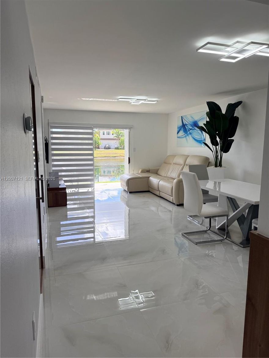 Welcome to your dream condo in Pembroke Pines! This stunning 2 bedroom, 2 bathroom unit has been fully remodeled to perfection. Step inside and be greeted by the sleek stainless steel appliances and beautiful tile flooring throughout. The new roof ensures peace of mind for years to come. The spacious bedrooms feature walk-in closets for ample storage space. The kitchen boasts quartz countertops and a wine cellar, perfect for entertaining guests. The luxurious bathrooms showcase walk-in showers and modern AC vents for ultimate comfort. With in-unit laundry for convenience, this condo truly has it all. Don't miss out on the opportunity to call this exquisite property home. Schedule a showing today and experience luxury living at its finest!