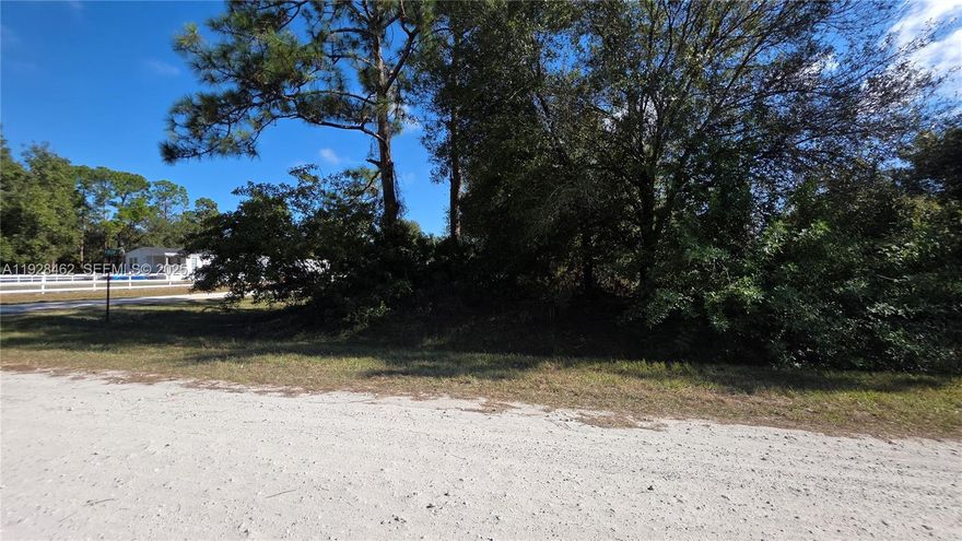 This 1.06 acre corner lot in Montura Ranch is Dry and High. Partially cleared with beautiful trees. This lot is waiting for your construction project or mobile home placement, allowing you to move sooner than you think. GREAT INVESTMENT OPPORTUNITY!!!! YOU CAN BUILD YOUR DREAM HOUSE OR INSTALL YOUR MOBILE HOME ENDLESS POSSIBILITIES!!! YOU CAN HAVE YOUR WEEKEND GETAWAY FROM THE CITY. YOU CAN HAVE YOUR FARM ANIMALS AND ENJOY THE CAMP STYLE OF MONTURA RANCH ESTATE. The Community offers a Clubhouse featuring a swimming pool, recreation facilities, parks, playground and basketball courts. NO Homeowners Association FEE.