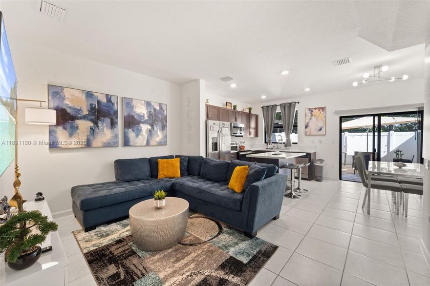 Stunning 3-bed, 3-bath townhouse in the desirable gated community of Aquabella, Hialeah! This home features a bedroom and bath on the first floor, an open-concept layout with a spacious kitchen, upgraded wood cabinets, stainless steel appliances, and pantry. Tile flooring downstairs and elegant laminated floors upstairs. The large primary suite offers a walk-in closet and private en-suite bath. Enjoy a landscaped patio perfect for entertaining. Resort-style amenities include 2 clubhouses, pools, gym, playground, and green spaces. Conveniently located near major highways and top schools. Property is currently rented through March 2026—great investment opportunity! HOA requires at least one applicant with a 680+ credit score.