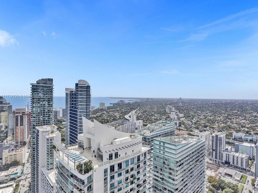 Soar above the Miami skyline in this 4BR+den / 4.5BA 52nd-floor penthouse at the iconic Brickell Flatiron. Offering 2,592 SF (per developer), this masterpiece boasts 10' ceilings, professional-grade Miele appliances, and premium Travertine flooring in the living areas, Italian marble in the bathrooms. Custom-designed closet cabinetry and electric shades/blackouts add to the refined living experience.

Wraparound terrace with breathtaking unobstructed panoramic bay and skyline views.

Brickell Flatiron, renowned as the pinnacle of luxury in Brickell, features first-class amenities on its top floor: rooftop pool, spa, fitness center, pilates, movie room, business center,.... Located in the heart of one of Miami's most vibrant neighborhoods, this residence truly redefines luxury living.