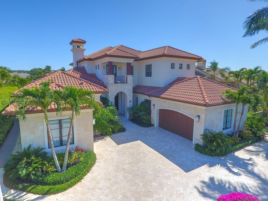 Newly renovated custom contemporary home located on a private island in prestigious Admirals Cove. Seconds from the intracoastal waterway sits this luxurious home that has been professionally designed to create an entertainer's paradise. Large heated pool with marble patio, a state of the art kitchen that any chef would envy, with gorgeous countertops, La Cornue gas range/oven, an in wall wine cellar and a large center island. This home features 2 master suites and 3 additional guest suites. First floor master has his/her separate baths, double vanities with stunning marble. Impact windows and doors, walk-in closets, elevator, gas fire pit & fireplace, whole house generator and room to accommodate a 60 ft yacht. Relax and enjoy tranquil sunset views from the 2nd floor balcony.