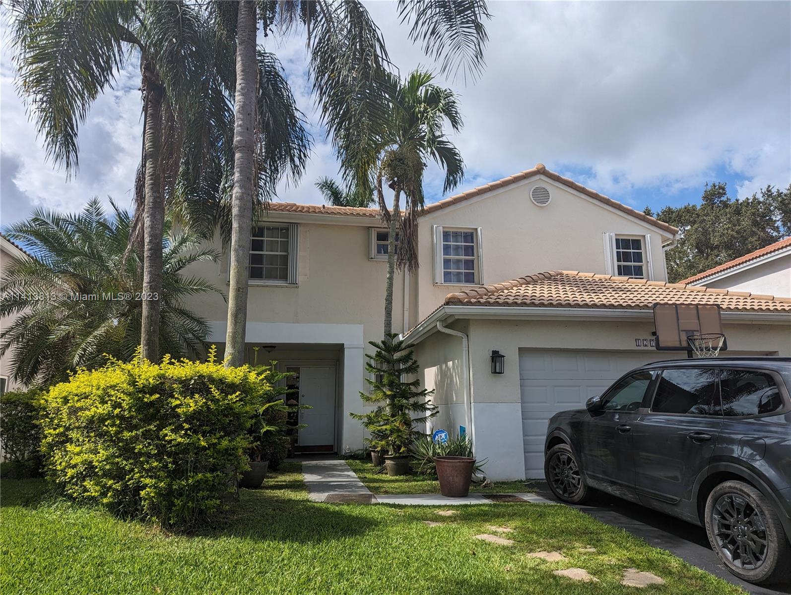 Tastefully updated 4 bedroom 2.5 bath one mile from Sawgrass mills. Nestled between 595 and the Sawgrass expressway, 3 minute drive to main retail shops (Aldi, Publix, Target, Sams club, Walmart). Great location! Home features a modern open kitchen(bottom kitchen cabinets will be repainted prior to tenant moving) with all stainless steel appliances and a mobile island. Porcelain wood tile on the first floor. Huge screened in patio and a spacious 2 car garage with additional parking in driveway. Upstairs flooring was updated to durable manufactured wood. Extra large master bedroom with a walk in closet. Upstairs guest bath and half bath in first floor were recently re-done.