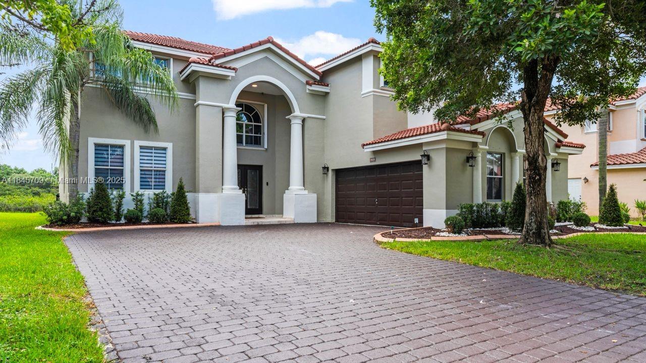 WELCOME HOME!! This stunning estate home showcases the community’s LARGEST floor plan, complete with an extended driveway. This home features 5 spacious bedrooms, 4 full bathrooms, and two luxurious primary suites. It also features a custom-designed staircase with dual access to the second floor, one staircase from the kitchen, and the other is from the beautiful living area, adding a unique architectural touch that no other home has. Elegant luxury vinyl wood flooring extends throughout the home, including the staircase, and all bathrooms and floors have been thoughtfully updated. 2 CAR GARAGE & STORAG! LOW HOA FEE! State-of-the-art water filtration system. 2 A/C’s from 2015. 2 TON & 3.5 TON, roof 2018.