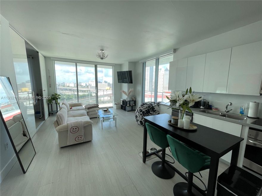 Bright corner unit at The Ivy Condominium featuring floor-to-ceiling windows, a large wrap-around balcony, stainless steel appliances, open layout with sliding doors, and in-unit washer/dryer. Gated community with 24-hour security, renovated spa, pool deck, gym, media and game rooms, and BBQ area. Water, basic cable, internet, and one assigned parking space included. Available Feb 1, 2025.