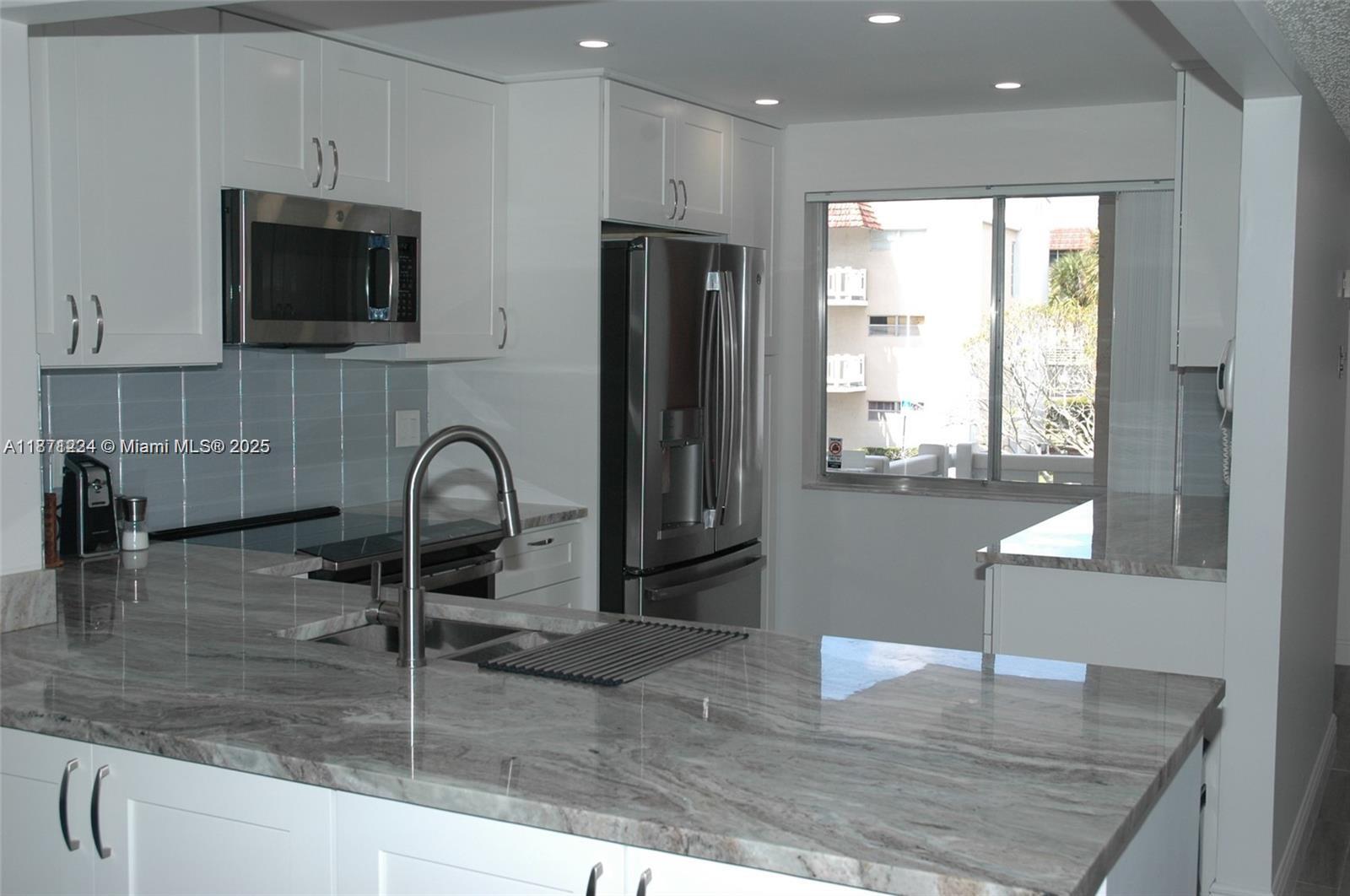 Here it is ladies and gentlemen.....one the most beautifully designed THREE BEDROOM and TWO BATHROOMS condo in a 55+ community for under $250,000.00. This property is located close to 3 synagogues and has been furnished with all top of the line GE profile appliances that are specifically designed for Sabbath mode.Tastefully designed chefs kitchen with lazy susanand spice slide out and ample break front storage for your Sabbath dinner ware and regular dinner ware. Newer HVAC unit,new water main turn off, new flooring,new GE profile washer and dryer WITHIN the property under AC. Unit is located at the end of the walk way. Hurricane shutters on all the windows. Community is primed for a cash infusion from investors in the surrounding golf courses.