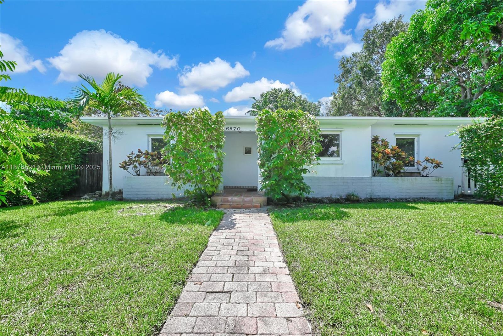 Nestled in one of Miami’s most sought-after neighborhoods, this charming starter home is filled with character and offers a blank canvas to make it your own. Featuring impact windows, a new AC system, and a desirable split floor plan, it combines comfort with endless potential. The property provides ample space to add an additional room, den, or enclose the terrace for extra square footage. With room for a pool and ultimate privacy created by mature hedges, this home can easily be transformed into your forever retreat.
