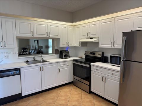 Photo of 1110 SW 125th Ave #209M, Pembroke Pines, FL 33027 (MLS # A11982565)