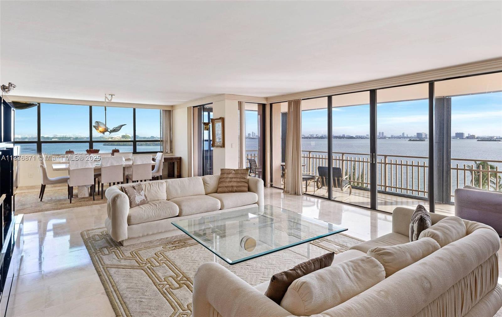 Situated directly on Biscayne Bay, this captivating SE corner unit boasts unparalleled wide bay views and is the most desirable line in the building. Offering 3 bedrooms and 2.5 bathrooms across over 2,750 square feet of living space, the residence features floor-to-ceiling windows, porcelain floors, and an expansive wrap-around balcony. A double-door entry leads to a foyer, formal living and dining rooms, an eat-in kitchen, The spacious master suite includes two large walk-in closets. Additional features include storm shutters and some impact windows. Substantial upgrades have been made to the lobby, hallways, elevators, gym, sauna, and pool, and a new jacuzzi has been added. Unit includes one covered parking spot, with additional options for self-parking or complimentary valet service.