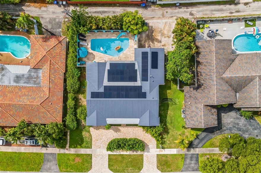 LARGE & OPEN 4 BEDROOM & 3 BATH HOME WITH SPACIOUS PATIO ALMOST 2500 SQ FT UNDER AC SINGLE FAMILY HOME. LOVELY FINISHES. PERFECT FOR ENTERTAINMENT. VERY LARGE AND FULL OF NATURAL LIGHT BEDROOMS. EVERY BEDROOM HAS CLOSET. PRIMARY BEDROOM WITH WALKING CLOSET. FORMAL DINING, LIVING ROOM. OPEN KITCHEN TO FAMILY ROOM, TILED FLOORS & LAMINATED. 2 CAR GARAGE ACCESS THRU ALLEY WITH CIRCULAR DRIVEWAY IN FRONT. GREAT POOL AREA WITH COVERED PATIO AND HURRICANE PROOF FRENCH DOORS. BRAND NEW METAL ROOF. IMPACT WINDOWS ACCORDION SHUTTERS. NATURAL GAS STOVE & WATER HEATER. CLOSE TO PLACES OF WORSHIP, PARKS, SHOPS, RESTAURANTS AND GREAT SCHOOLS. GREAT PRIVACY. BRAND NEW METAL ROOF 2024. SOLAR PANELS.  PETS OKAY.  RENTED UNTIL JULY 31st, 2026.