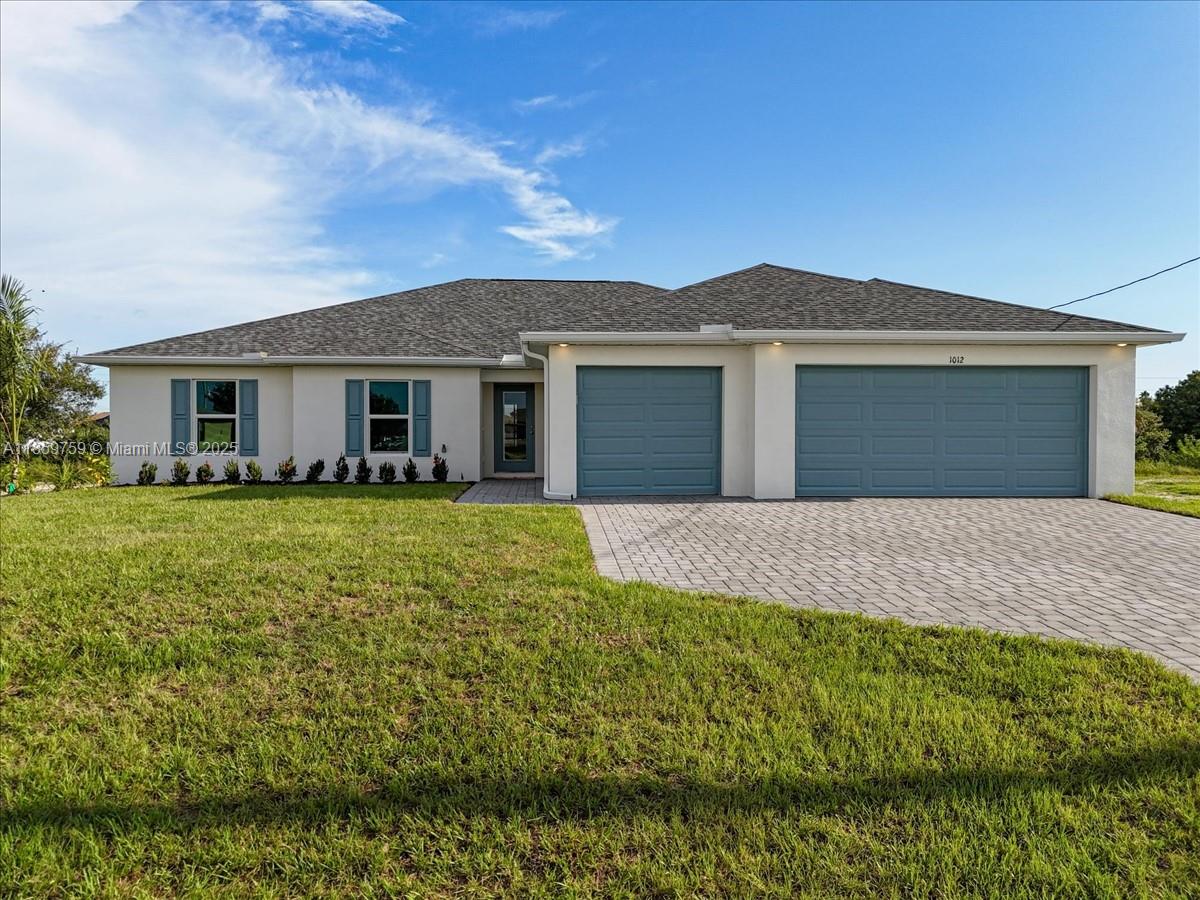 WATERFRONT PARADISE WITH DUAL PRIMARY SUITES & HEATED POOL! Nestled on a scenic freshwater canal, this expansive 4-bedroom, 3-bath home offers serene water views and the perfect blend of comfort and elegance. The gourmet kitchen is a chef’s dream, featuring soft-close, all-wood cabinetry, quartz countertops, stainless steel appliances, and an oversized walk-in pantry—perfect for hosting and everyday convenience. Whether you love kayaking, fishing, or simply unwinding by the water, this home delivers the ultimate Florida lifestyle! Built by a trusted local builder, this home offers exceptional value with impact windows, no flood zone for peace of mind, and a 10-year structural warranty for lasting confidence. This is The Paradise Cove Plan